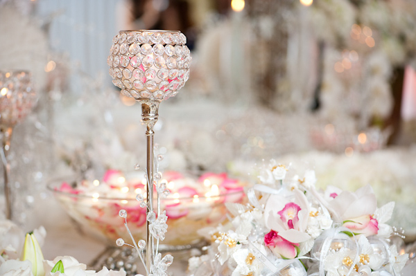 reception decor details - rhinestone candle holders and dark pink, light pink, and ivory rose petals in bowl - photo by Houston based wedding photographer Adam Nyholt